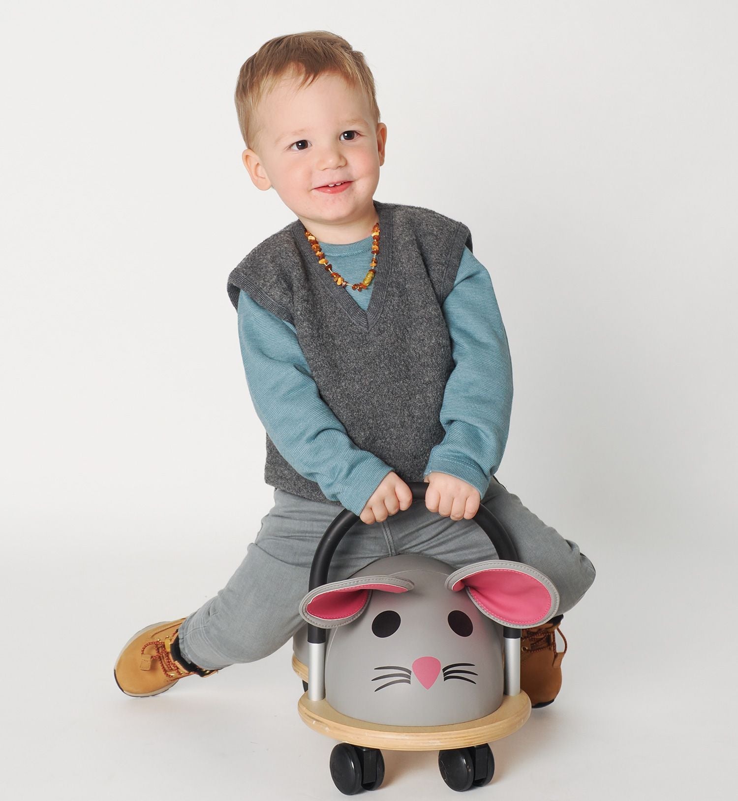 Lifestyle photo of the wool kids vest in charcoal by Reiff