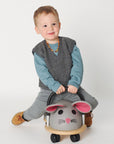 Lifestyle photo of the wool kids vest in charcoal by Reiff