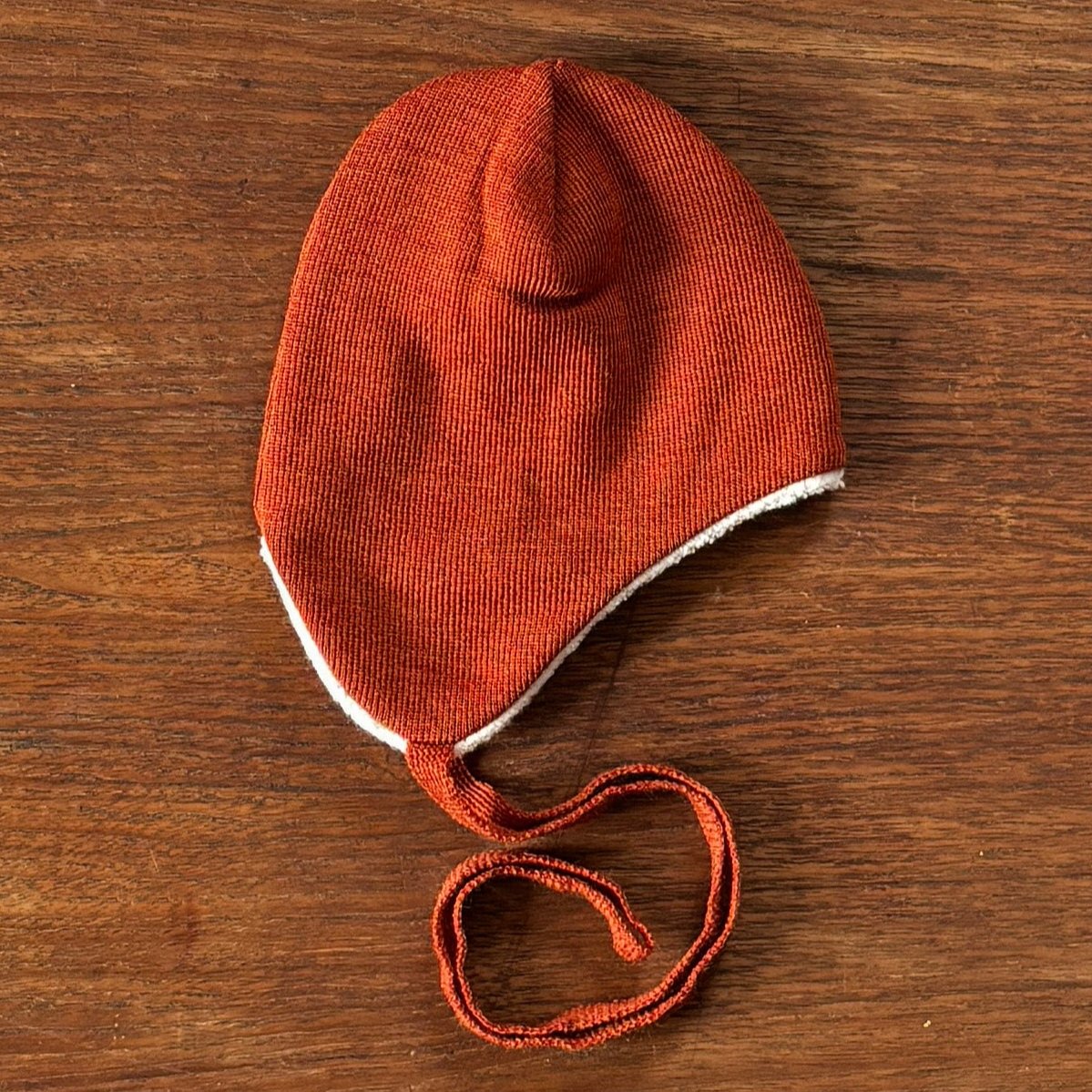 100% wool hat in rust. By Reiff.