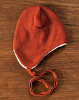 100% wool hat in rust. By Reiff.