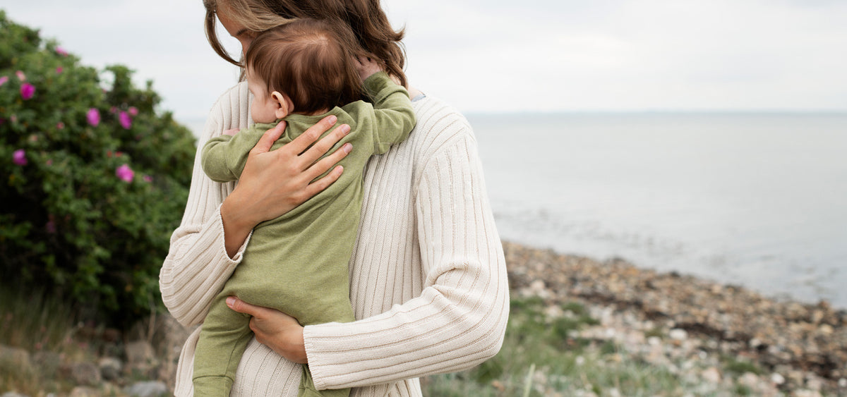 Lifestyle image of mother and baby in Serendipity Organics overall