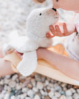 Small boy playing with the Senger Cuddly organic cotton non-toxic small white seal 