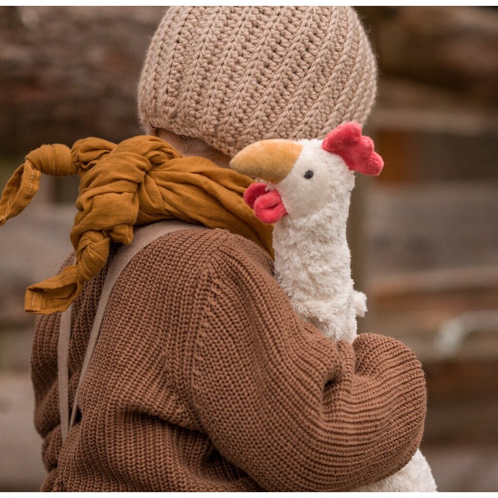 Child hugging the Senger organic cotton non-toxic Cuddly white small chicken 