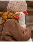 Child hugging the Senger organic cotton non-toxic Cuddly white small chicken 