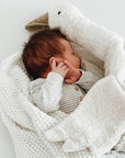 Baby sleeping with Senger Cuddly large white goose made of organic cotton non-toxic materials