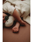 Baby sleeping with Senger Cuddly large white goose made of organic cotton non-toxic materials
