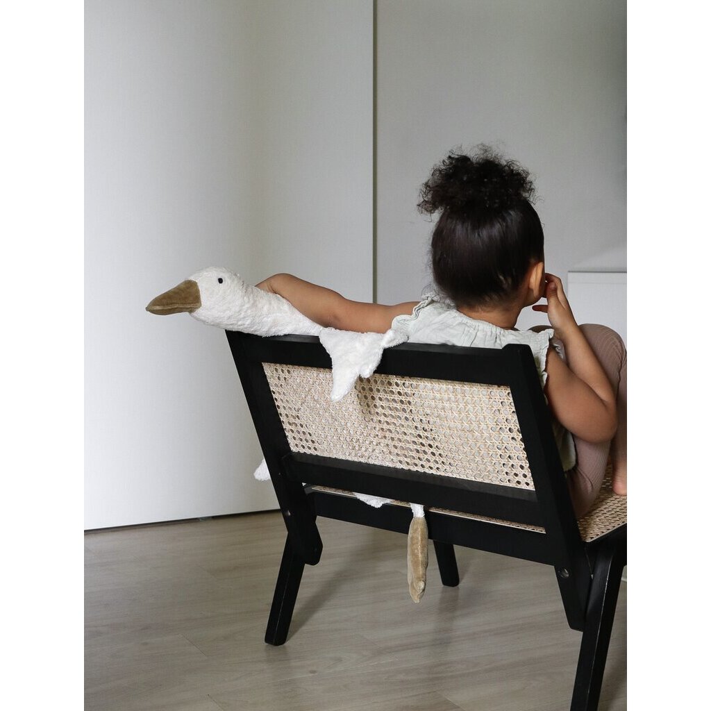 Young girl sitting with Senger Cuddly large white goose made of organic cotton non-toxic materials