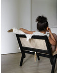 Young girl sitting with Senger Cuddly large white goose made of organic cotton non-toxic materials