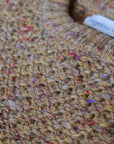 Close up of the tuck sweater in wheat