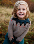 Girl in Serendipity Organics Alpaca mountain sweater