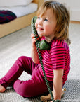 Toddler in striped raspberry and orchid wool and silk Engel tee