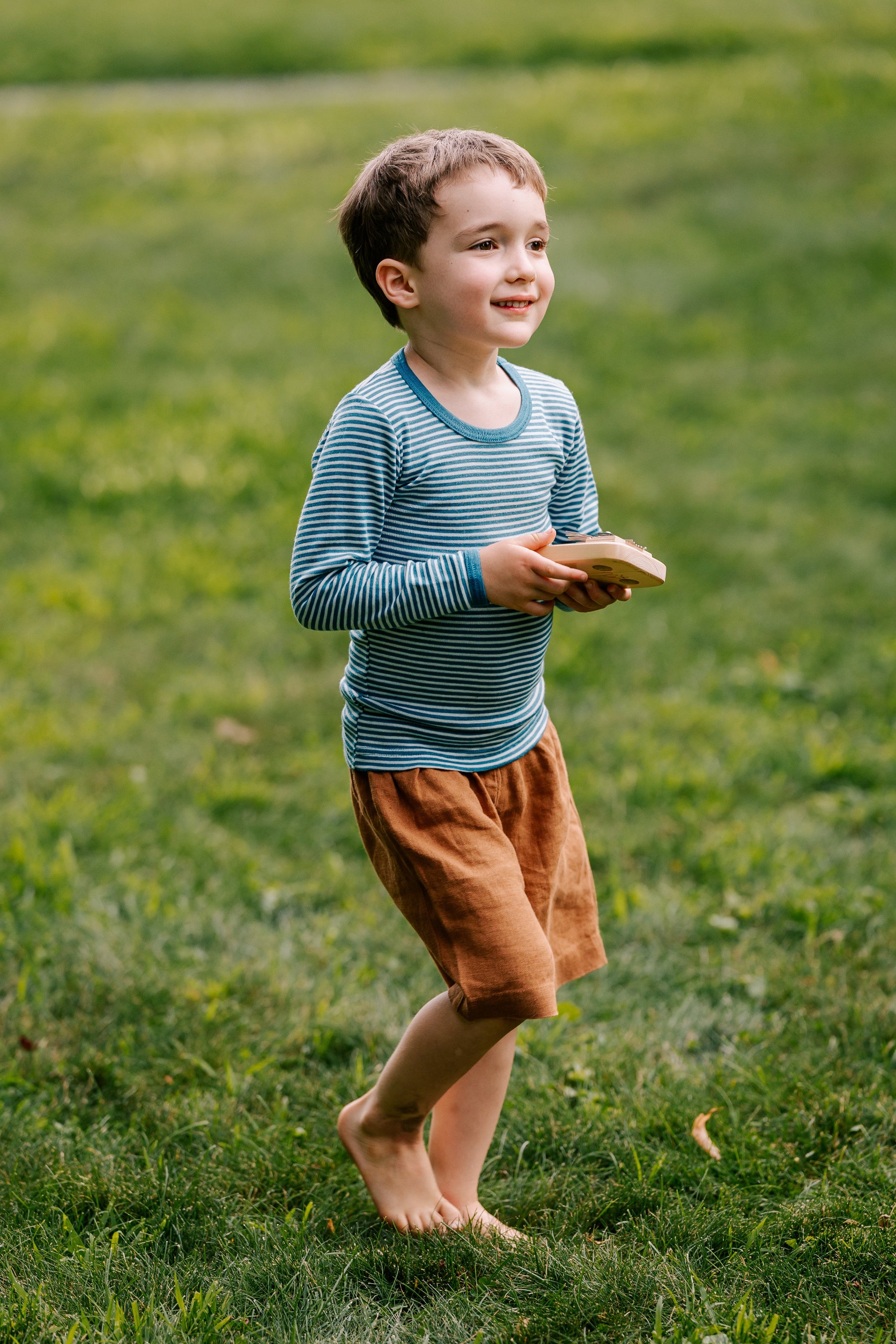 Boy in Hocosa stripe wool/silk shirt and Bigelow Lane linen shorts