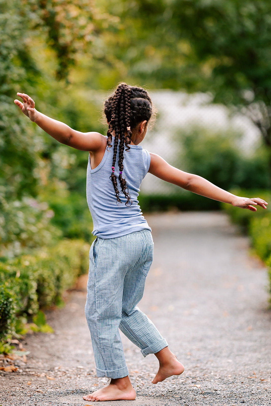 Boy playing in Hocosa wool/silk tank top