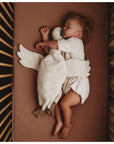 Baby sleeping with Senger Cuddly large white goose made of organic cotton non-toxic materials