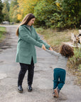 Lifestyle photo of the Engel boiled wool kids pants in Pacific