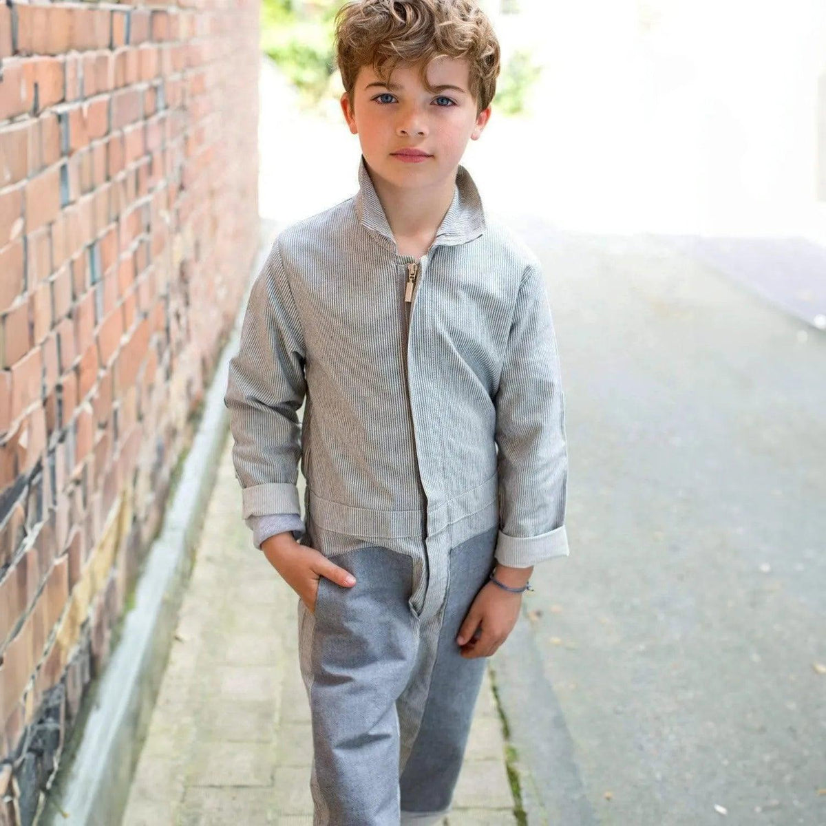 Lifestyle photo of the Jackalo mac coverall in pin stripe