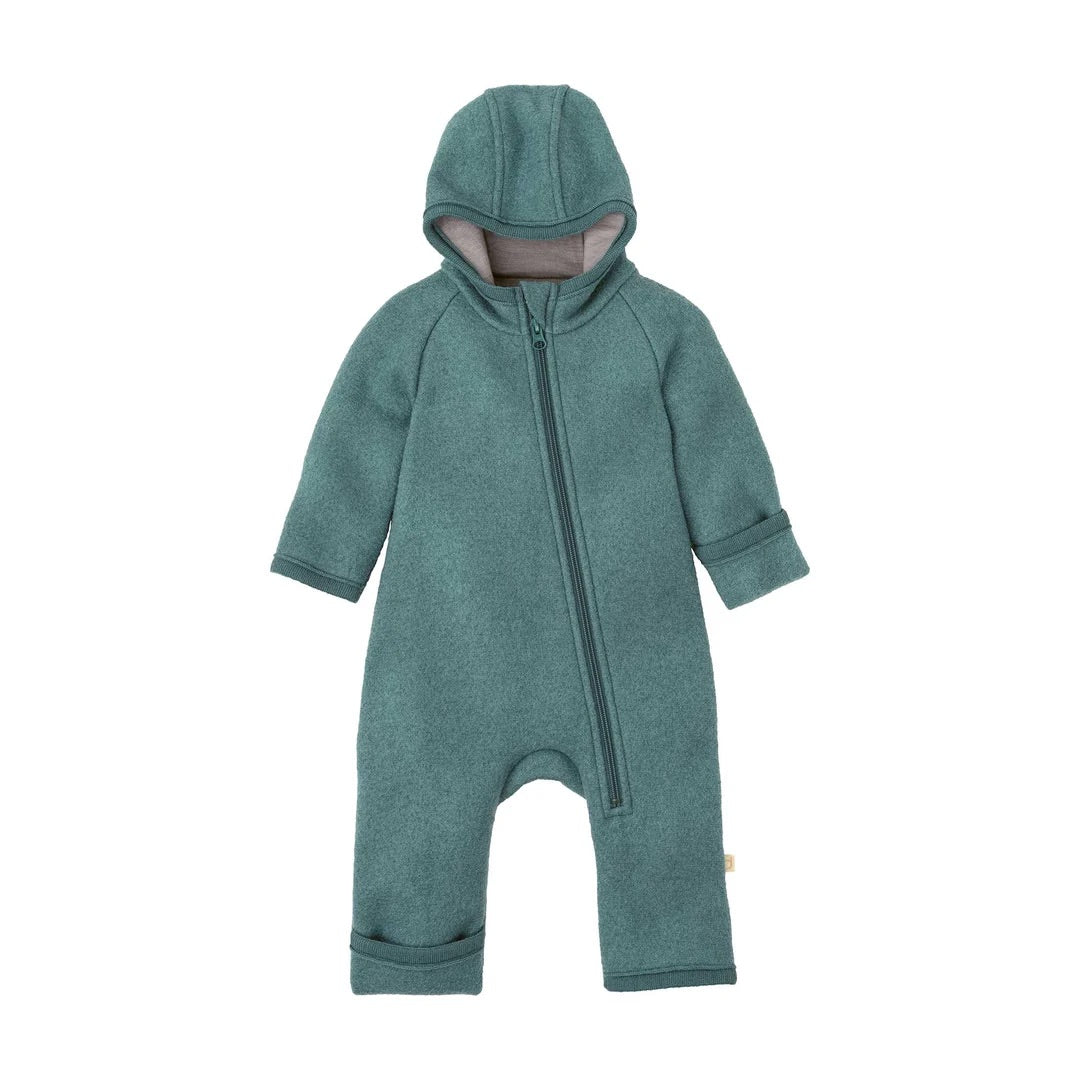 Disana boiled organic wool zip overall in eucalypus showing the smaller size with folder over cuffs.